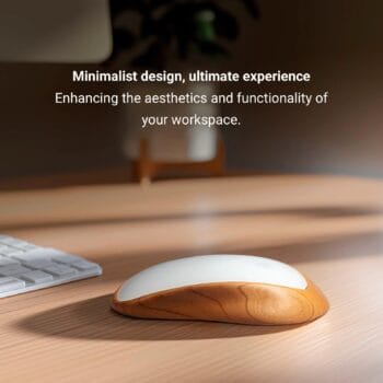An Apple Magic Mouse rests on a minimalist wooden stand with a 15° ergonomic tilt, placed on a desk next to a laptop. The text overlay reads, 